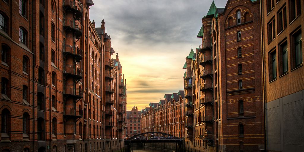 river between brown concrete buildings