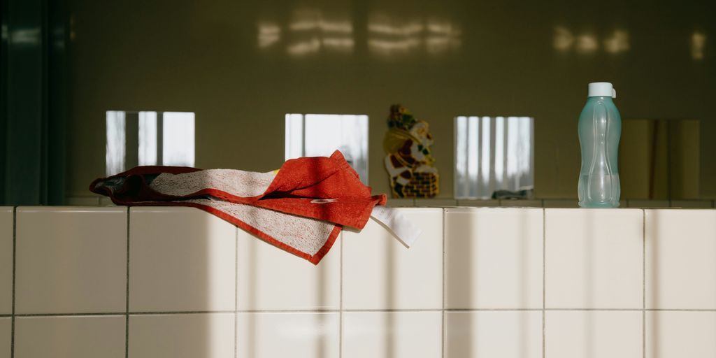 red textile on white tiles