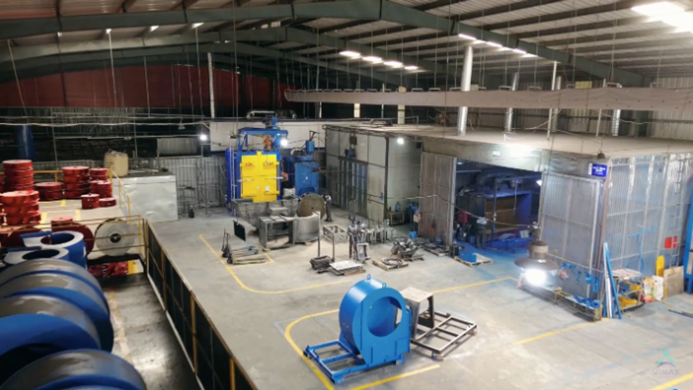 A spacious industrial facility with machinery and equipment.