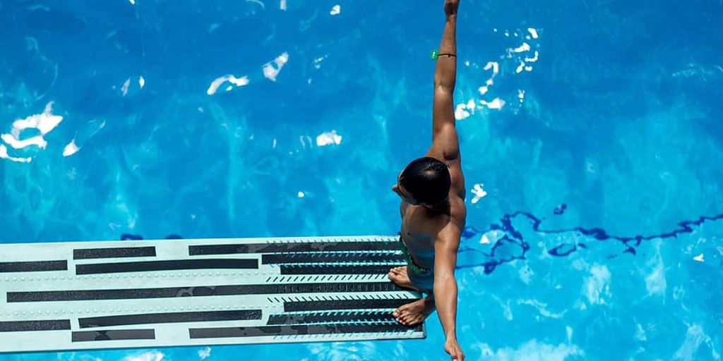 swimmer eating honey poolside