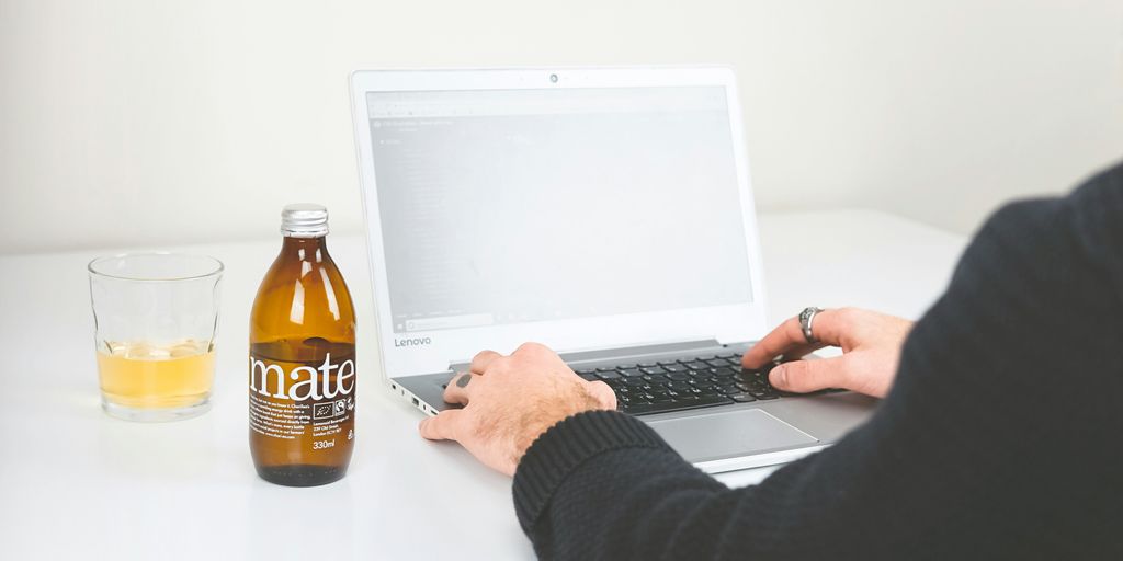 person using gray laptop