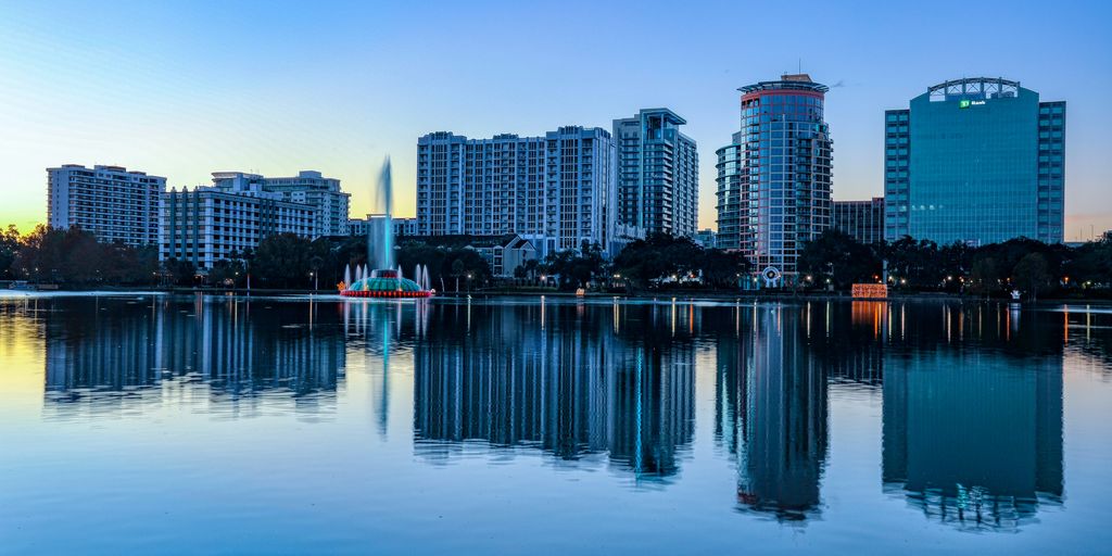 city skyline across body of water during daytime
