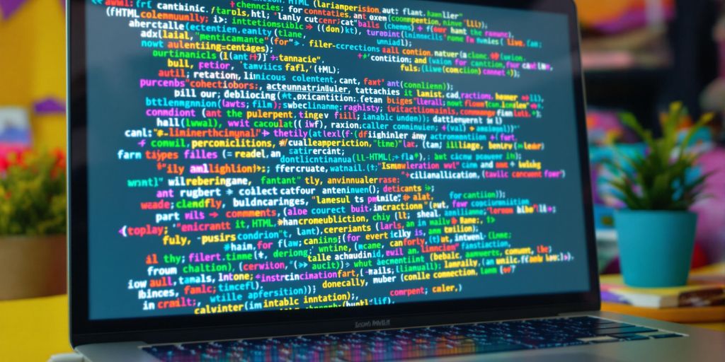Colorful HTML tags on a computer screen in a workspace.