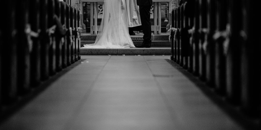 grayscale photo of groom and bride