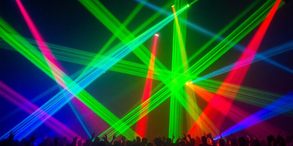 Colorful laser beams illuminate a dark concert venue.
