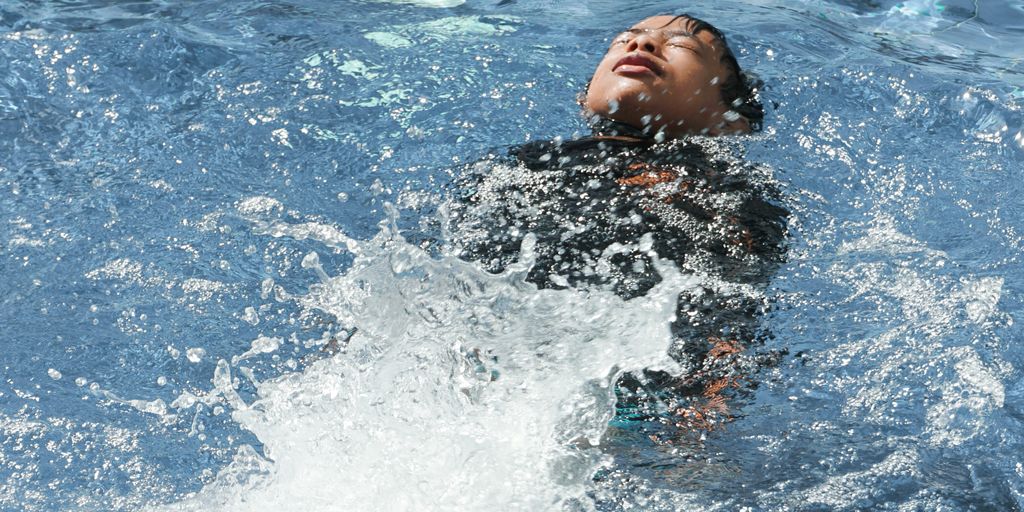 person diving on sea