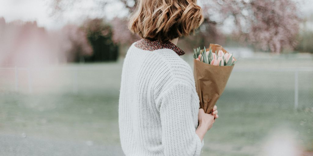 woman holding flower bouquet