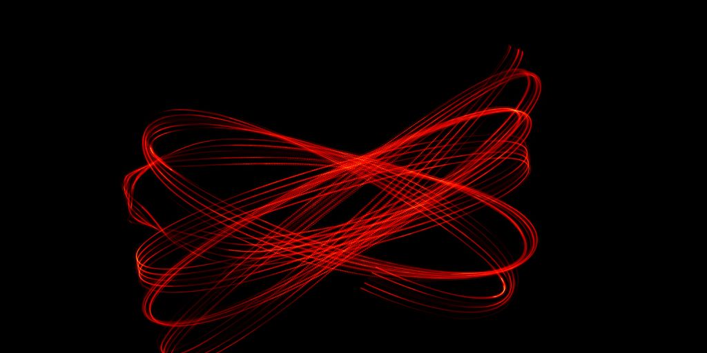 A blurry image of a red object on a black background