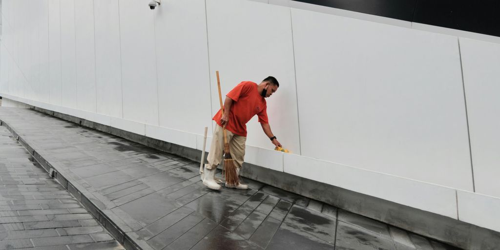 a man walking on a sidewalk