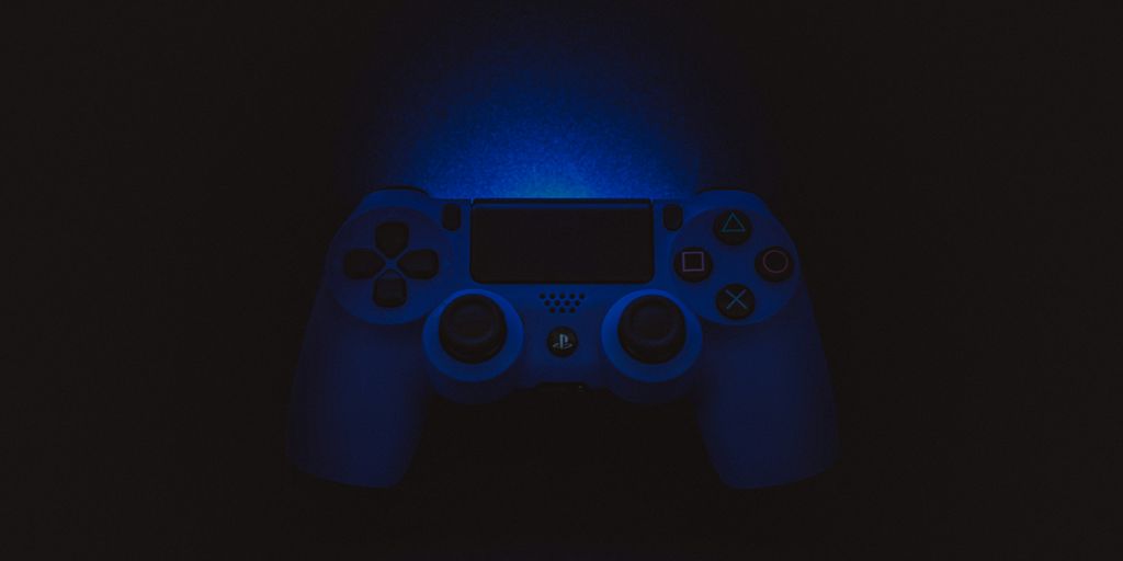 silhouette photography of Sony DualShock 4