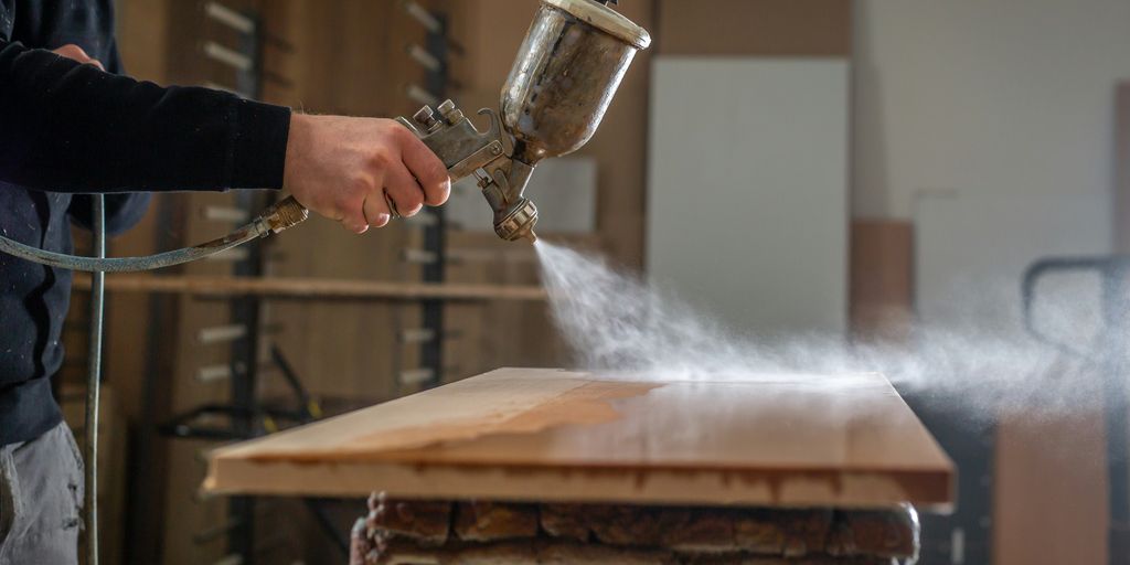 a person using a grinder on a wooden table
