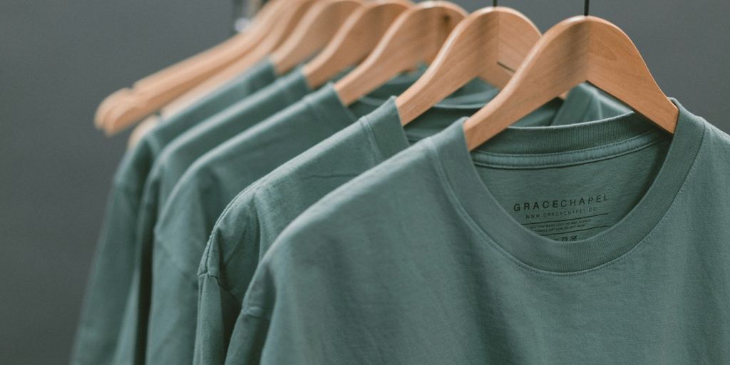photo of blue crew-neck tops