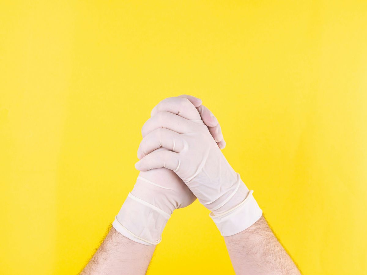 person in white long sleeve shirt holding hand of person in white long sleeve shirt