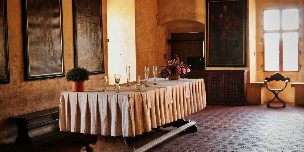brown wooden table with white table cloth