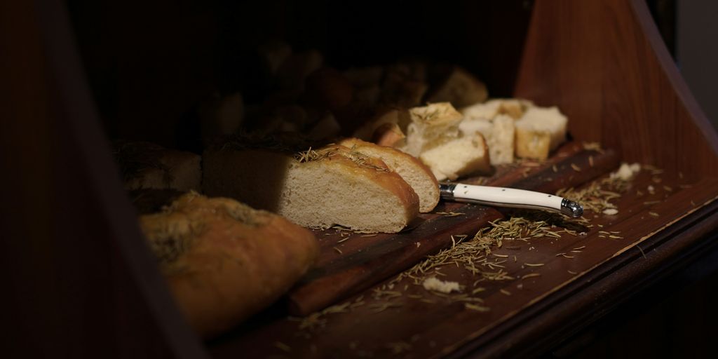 sliced bread on brown wooden table