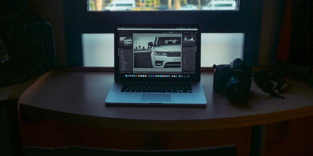 MacBook Pro displaying white vehicle