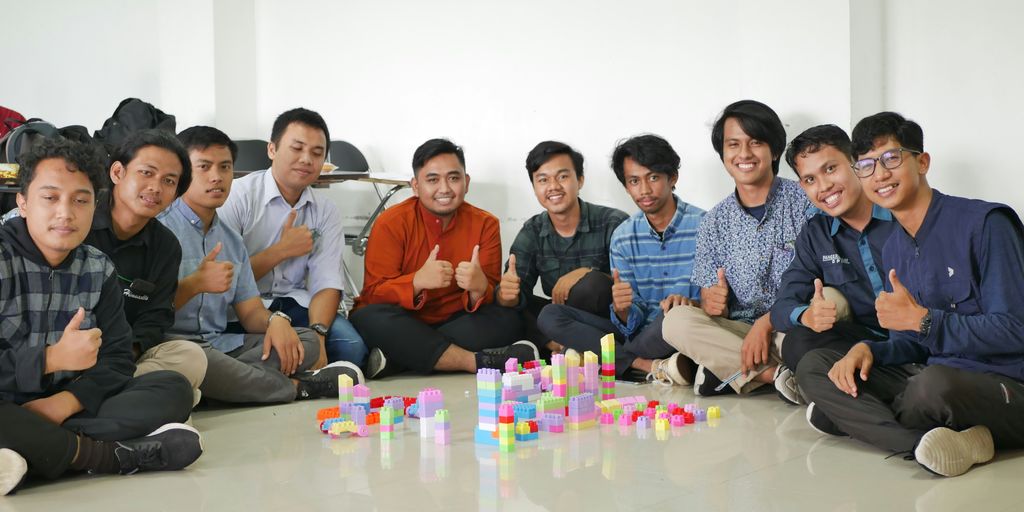 a group of men sitting next to each other
