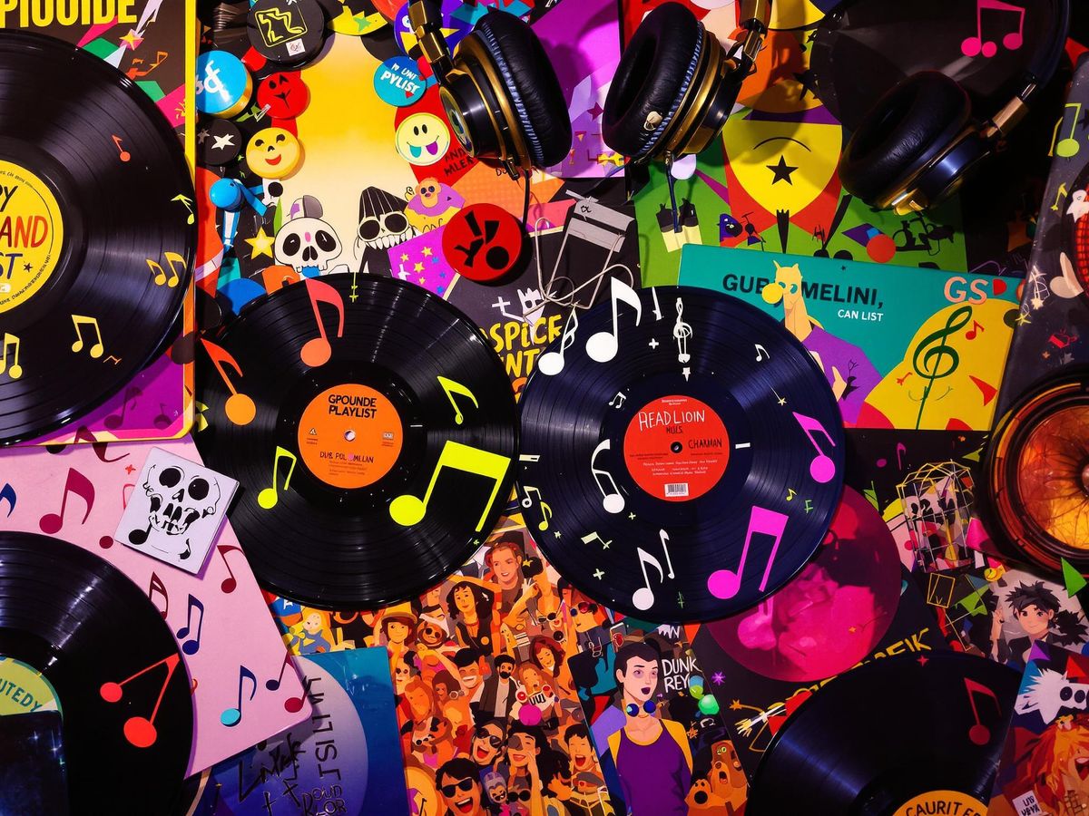 Colorful music notes and vinyl records with headphones.