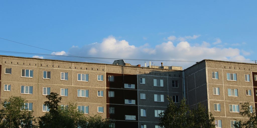 a tall building with lots of windows on top of it
