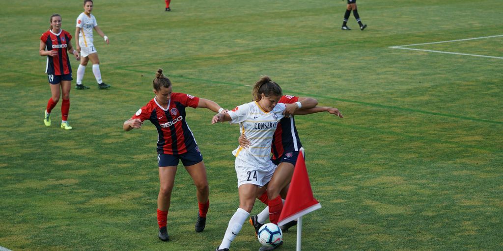 group of women playing soccer