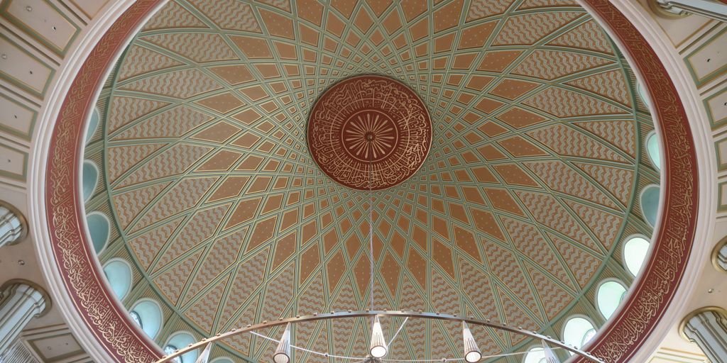 a domed ceiling in a building with many windows