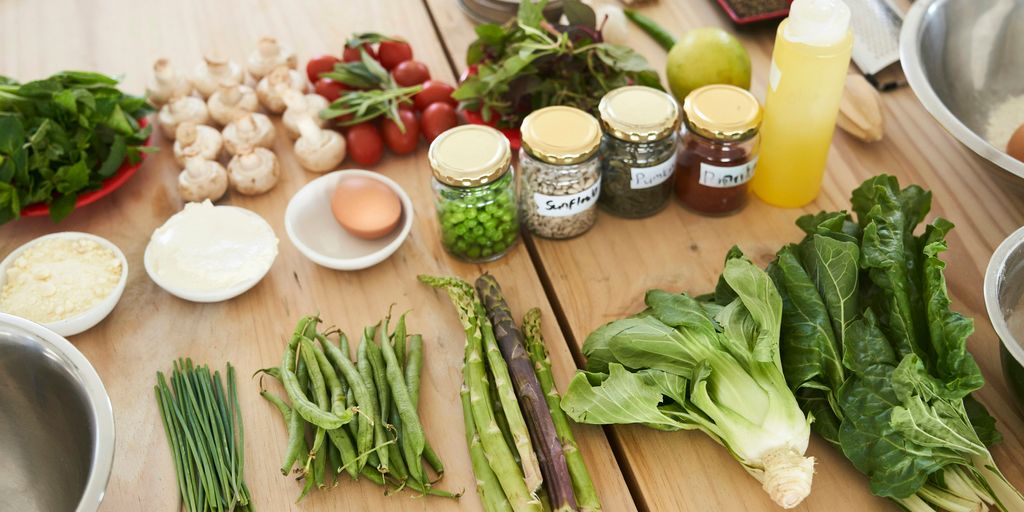 green vegetable on brown wooden table