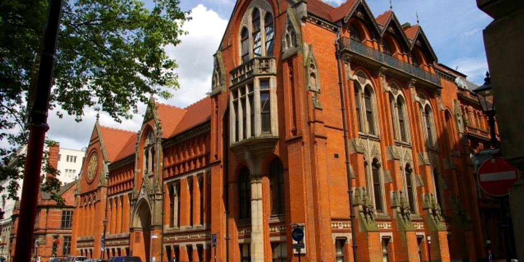 art lovers exploring museums and galleries in Birmingham city with vibrant street art in the background