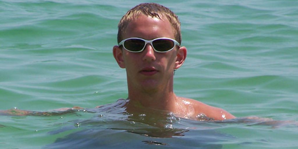 swimmer eating bagel before competition