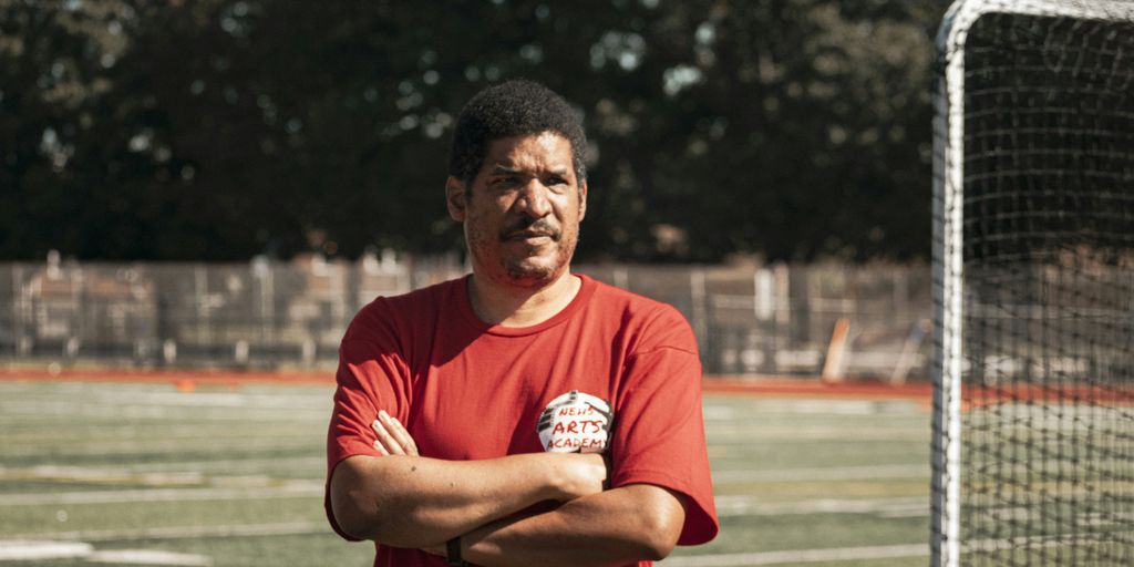 a man standing in front of a soccer goal