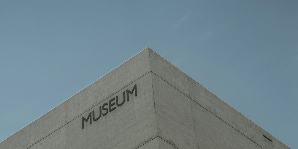 a tall building with a museum sign on it's side