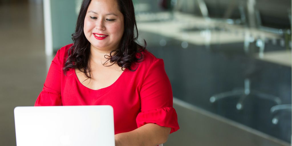 selective focus photography of woman using laptop computer