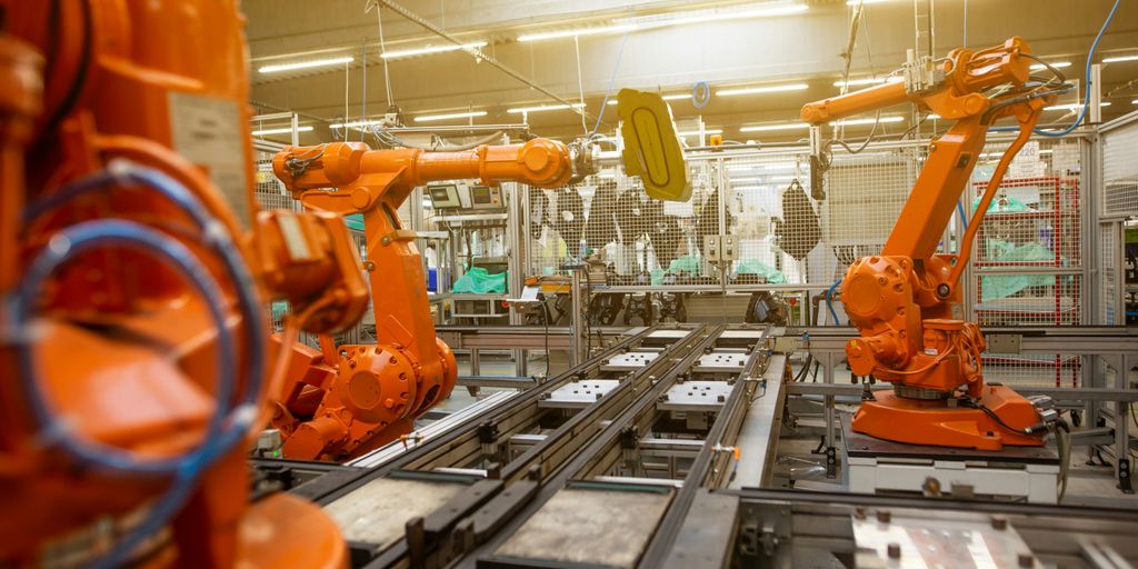 a factory filled with lots of orange machines