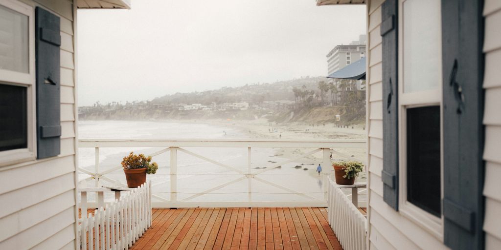 white wooden fence on brown wooden dock during daytime