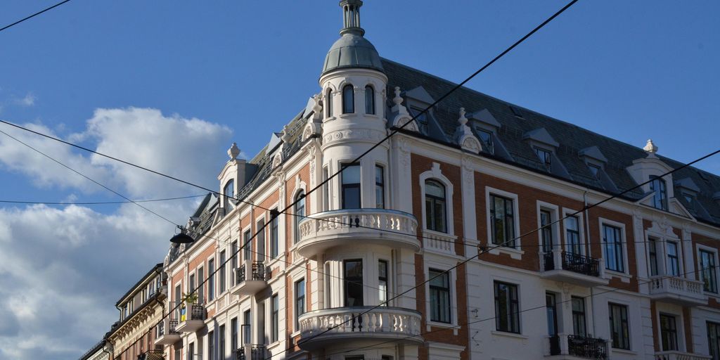 a tall building with a clock on the top of it