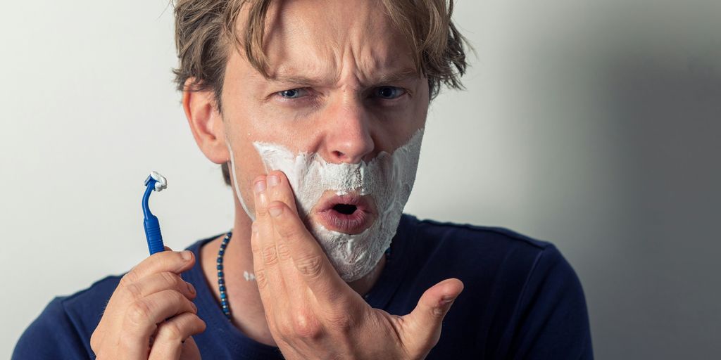 woman in blue long sleeve shirt with white face mask