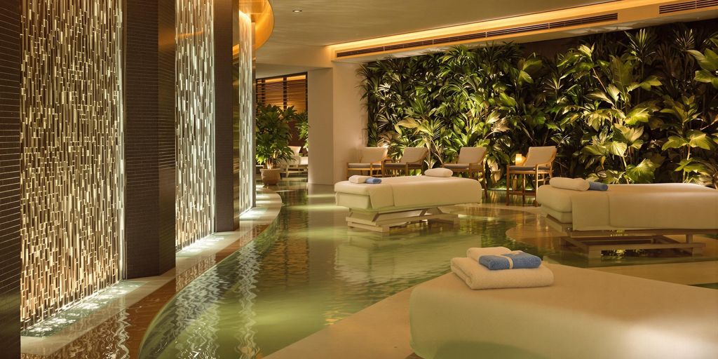 Spa treatment area with calming water and greenery.