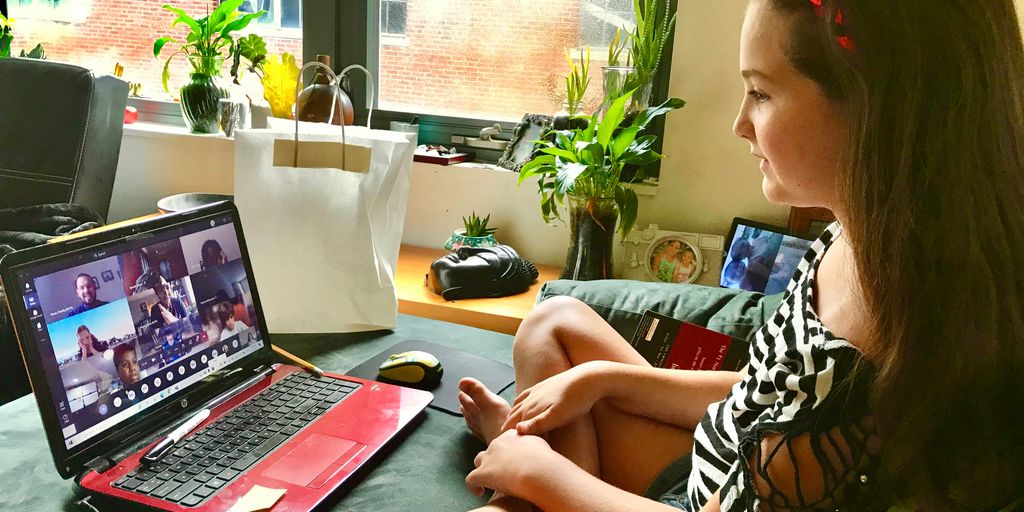 woman in black and white zebra print shirt using macbook pro