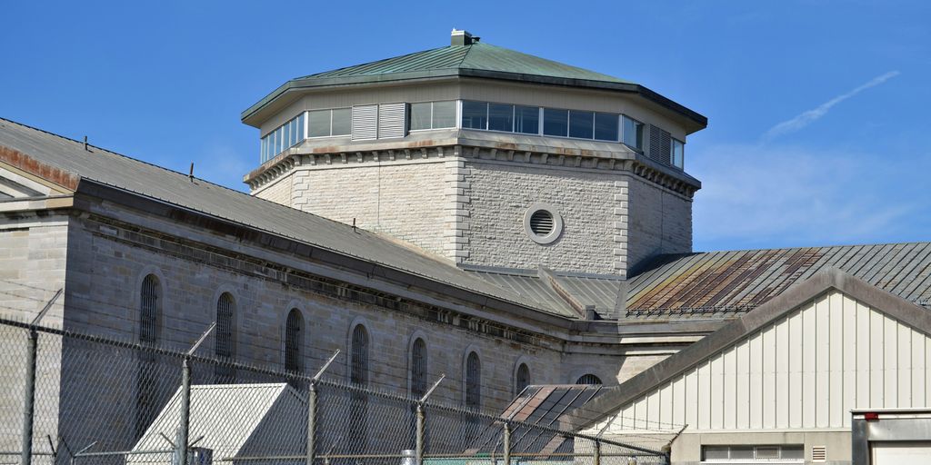 a tall building with a clock on the top of it