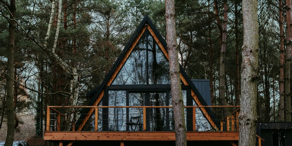 a cabin in the woods surrounded by trees