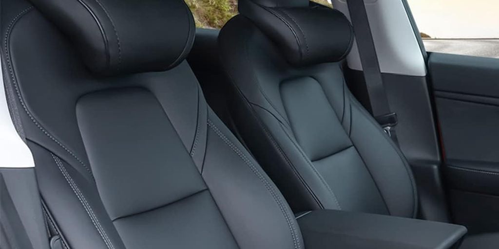 Interior of a car featuring sleek, black leather seats.