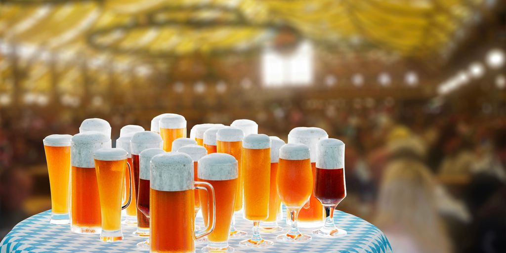 a table topped with lots of glasses of beer
