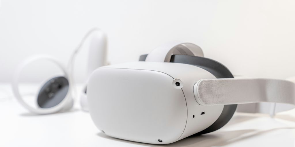 Virtual reality headset and headphones representing emerging technologies for virtual meetings and collaboration in business.