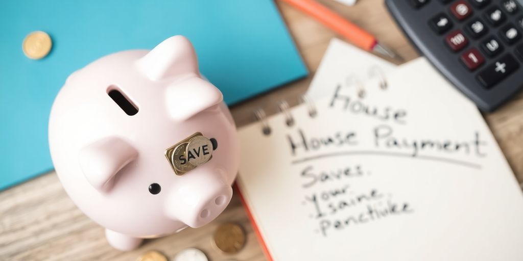 Piggy bank, calculator, and notepad for saving efforts.