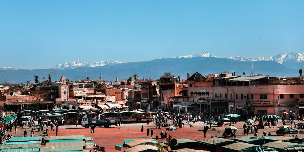 brown wooden table and chairs on a sunny day
