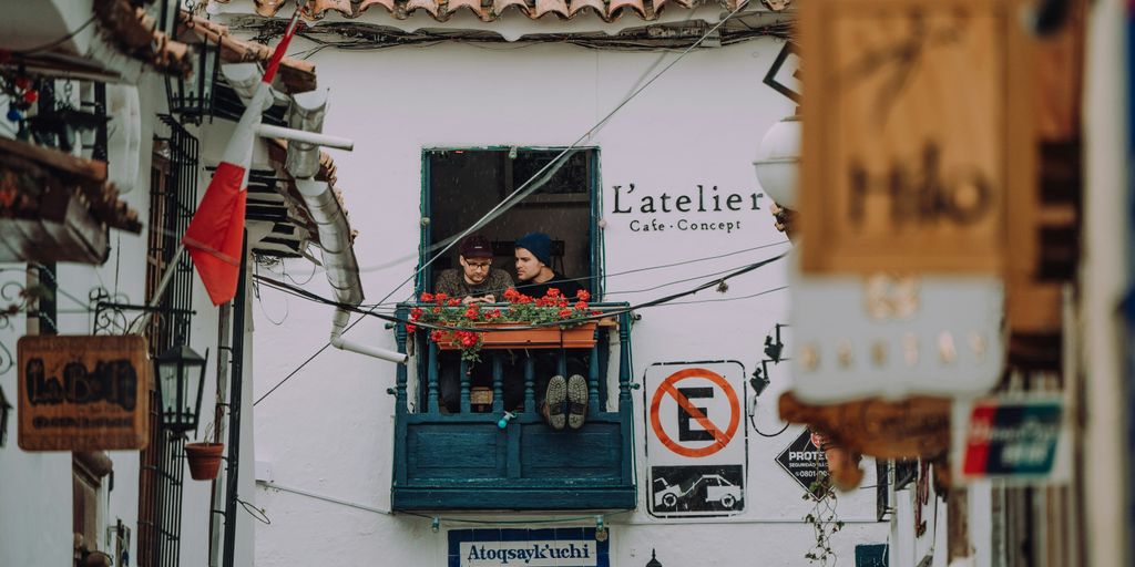 two person on balcony during daytime