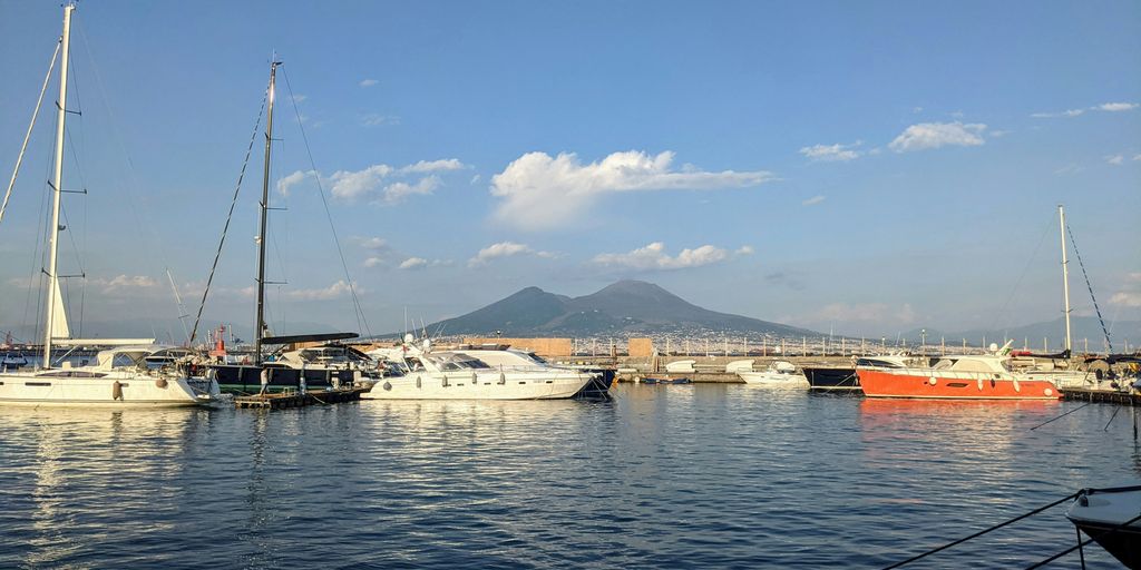 a harbor filled with lots of boats under a blue sky