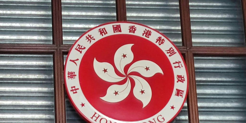 a round red and white sign with a cartoon character on it