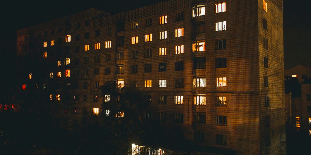 brown high-rise buildings during night time