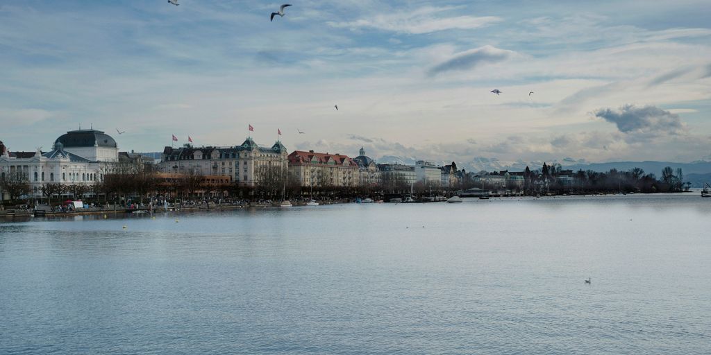 a body of water with a bunch of buildings in the background