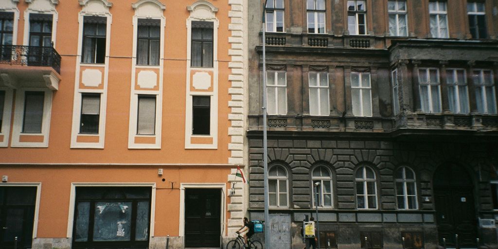a building with a person riding a bicycle
